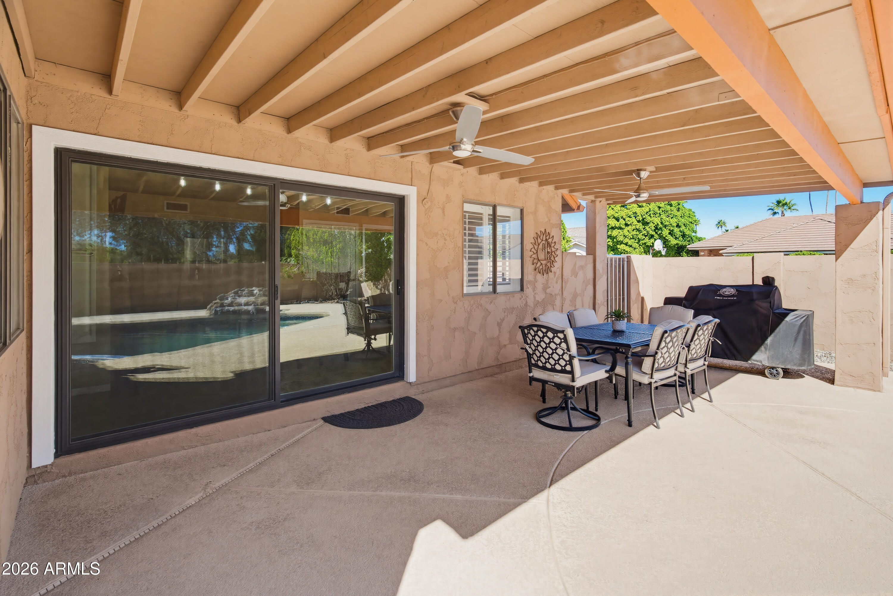 841 North Gentry Mesa, AZ 85213 - Photo 47 of 74 a building outdoor space with patio furniture and potted plants