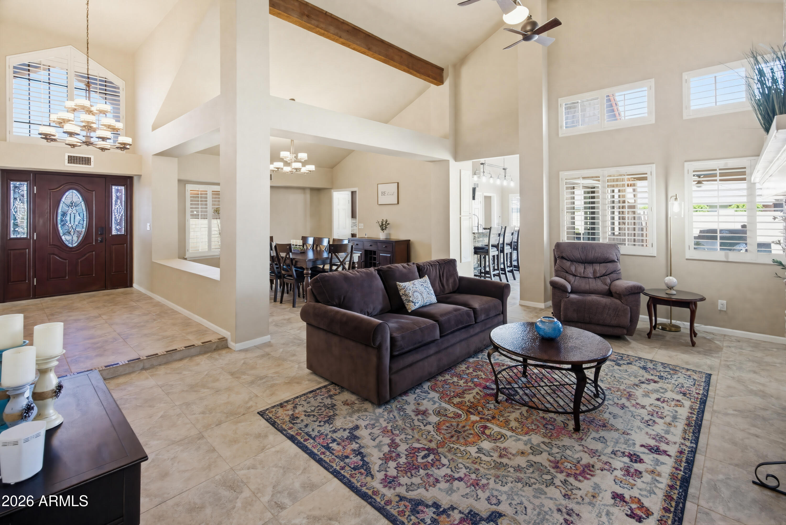 841 North Gentry Mesa, AZ 85213 - Photo 6 of 74 a living room with furniture and a chandelier