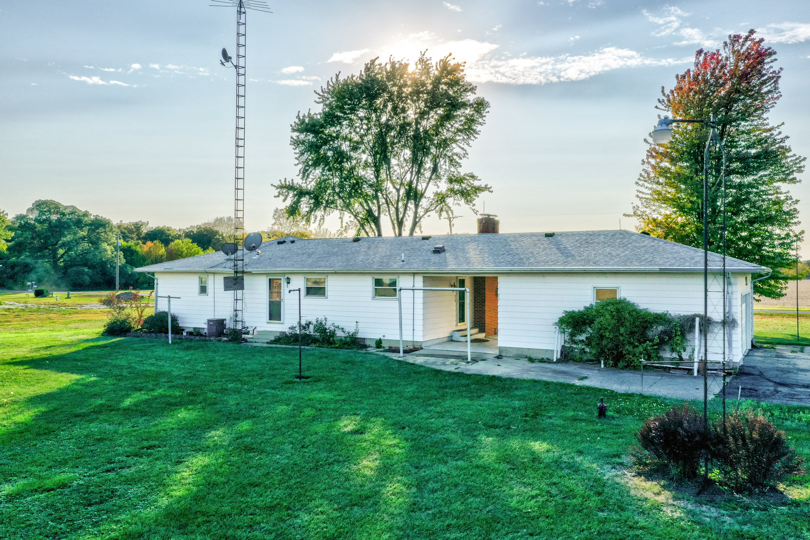 1526 East 18th Road Streator, IL 61364 - Photo 22 of 23 a front view of a house with a garden and yard
