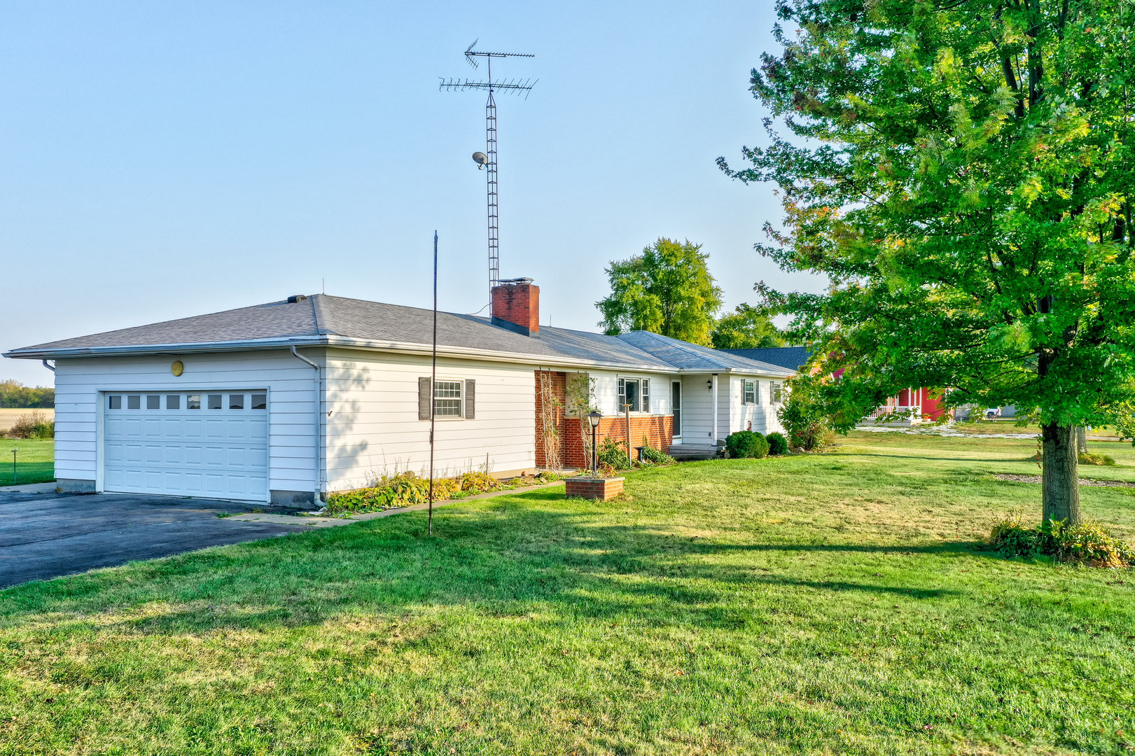 1526 East 18th Road Streator, IL 61364 - Photo 3 of 23 a front view of a house with a yard and trees