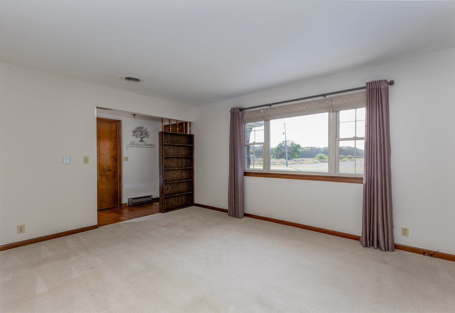 1526 East 18th Road Streator, IL 61364 - Photo 6 of 23 a view of an empty room with a window