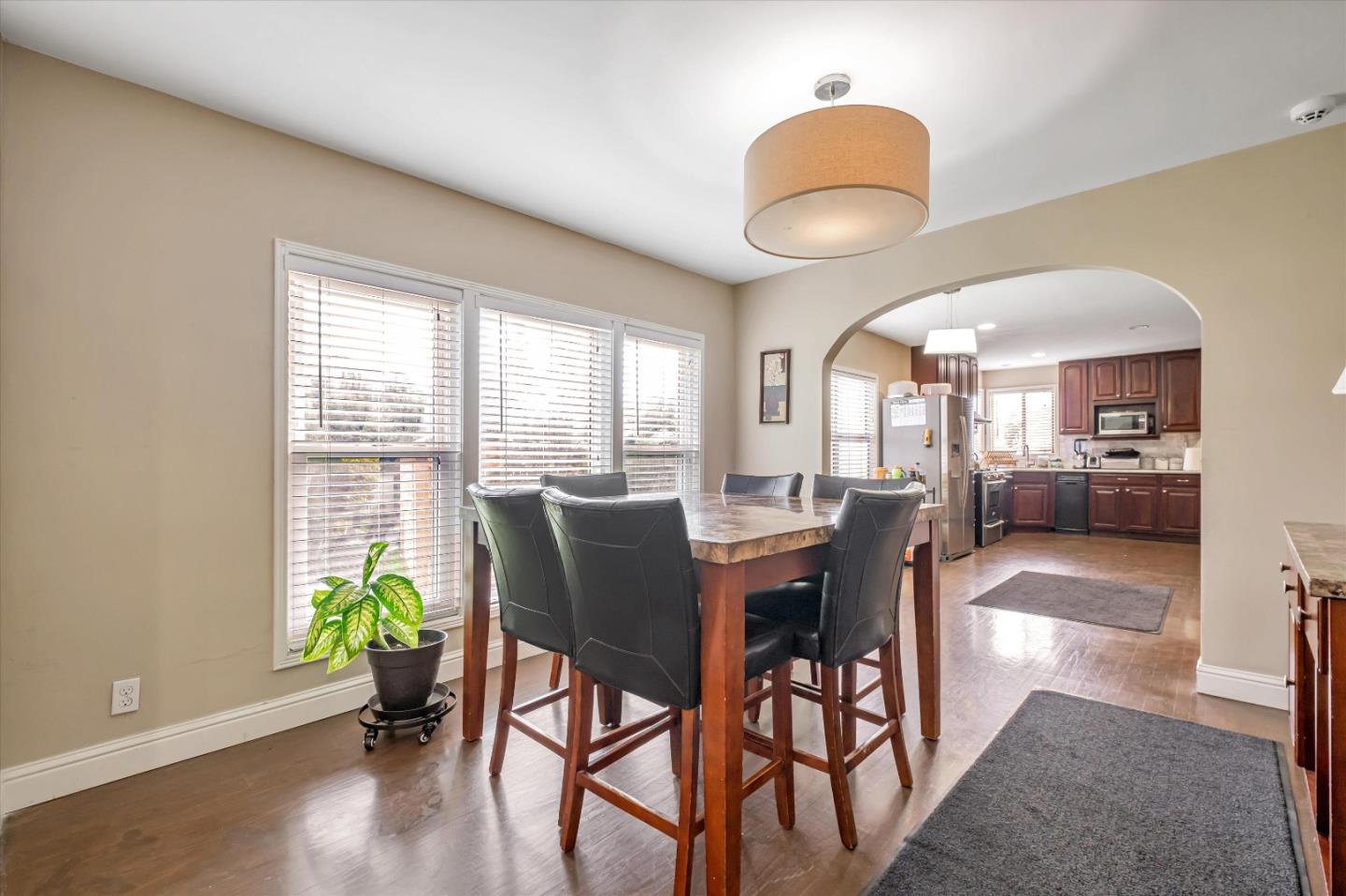 8245 Golf Links Road Oakland, CA 94605 - Photo 16 of 41 a view of a dining room with furniture window and wooden floor