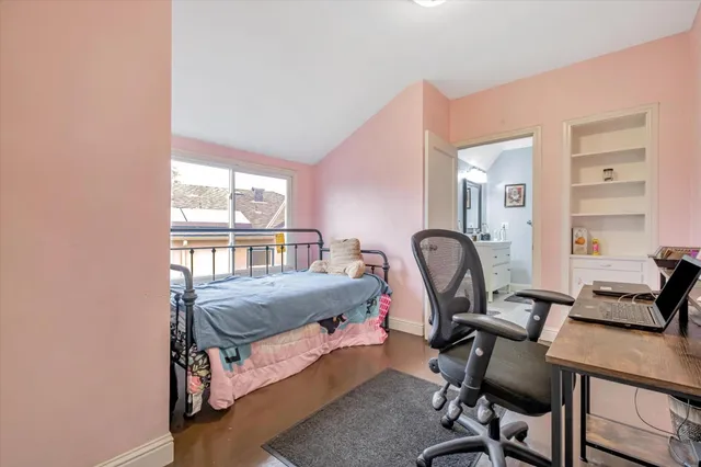 a work room with furniture and a window