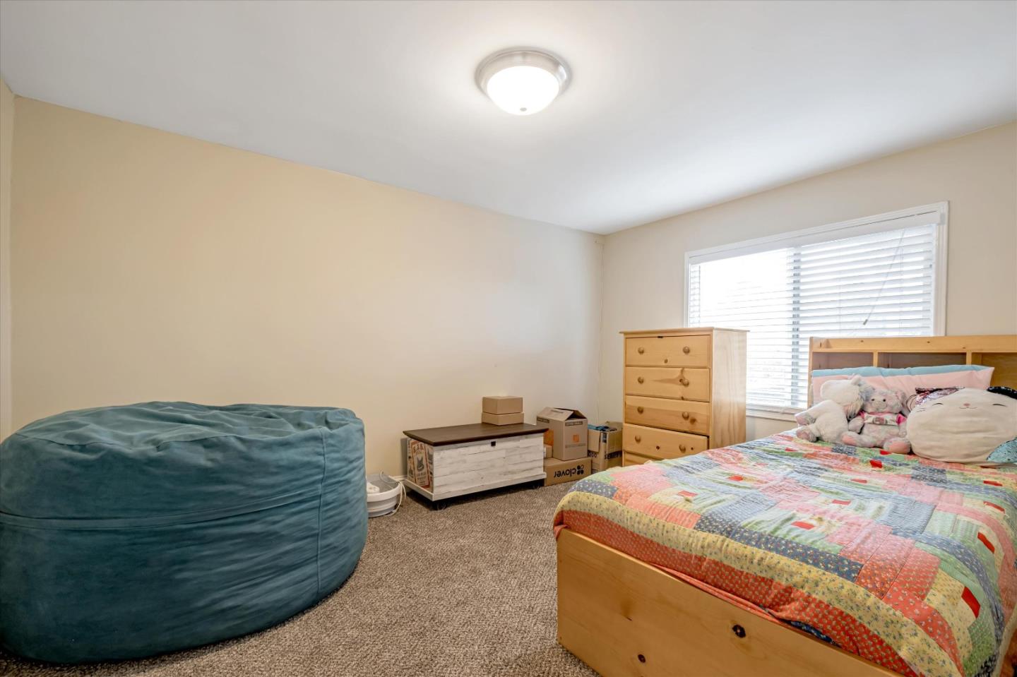 8245 Golf Links Road Oakland, CA 94605 - Photo 25 of 41 a bedroom with two beds and a dresser