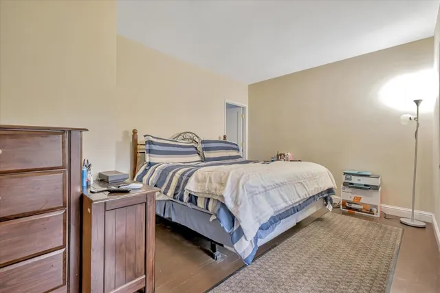 a bedroom with a bed and cabinets