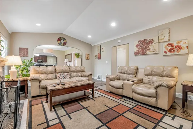 a living room with furniture and a rug