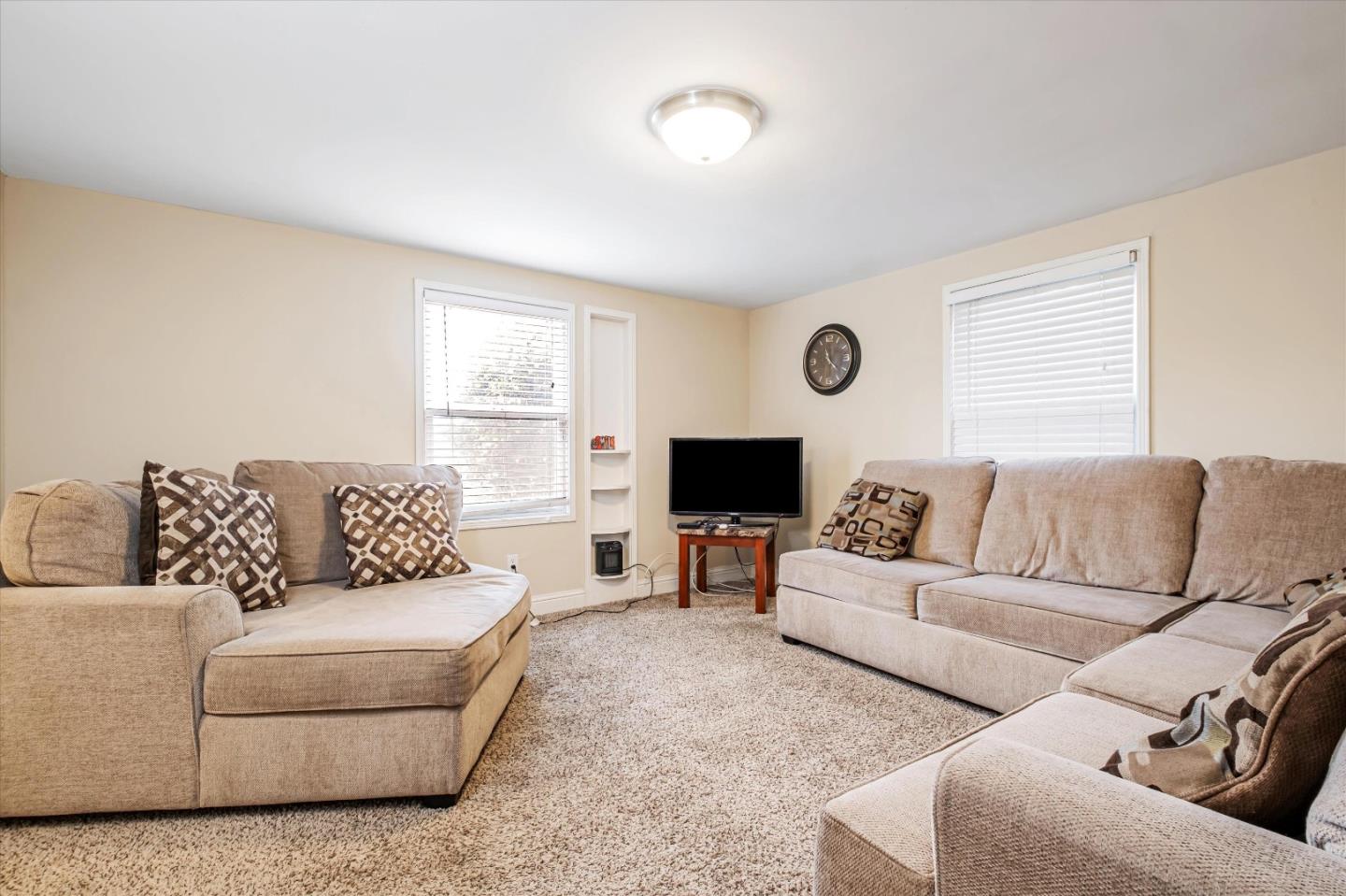 8245 Golf Links Road Oakland, CA 94605 - Photo 9 of 41 a living room with furniture and a flat screen tv