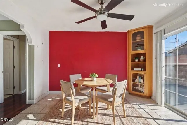 a view of a dining room with furniture and chandelier