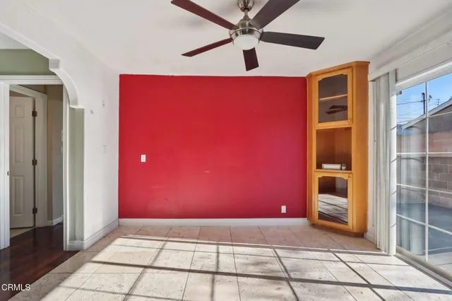 a view of an empty room with glass door