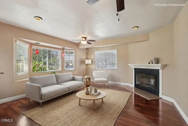 a living room with furniture and a fireplace