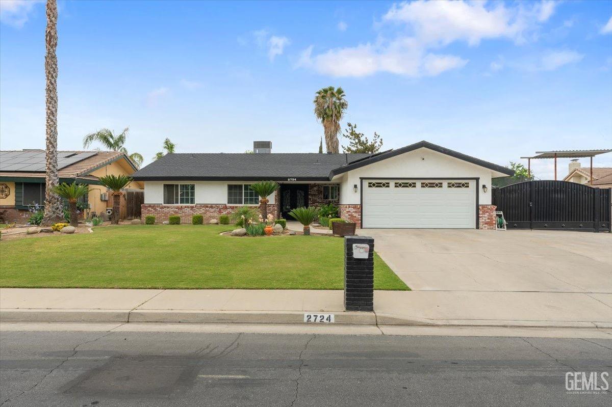 Undisclosed Address Bakersfield, CA 93309 - Photo 1 of 30 a front view of a house with a yard
