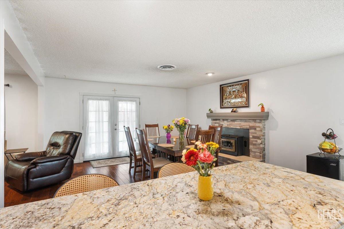 Undisclosed Address Bakersfield, CA 93309 - Photo 15 of 30 a living room with furniture a fireplace and a flat screen tv
