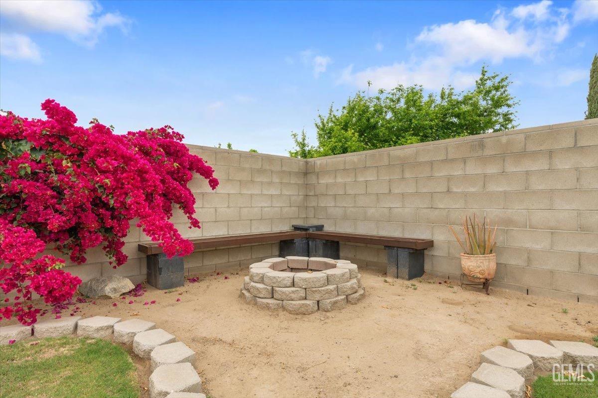 Undisclosed Address Bakersfield, CA 93309 - Photo 21 of 30 a front view of a house with a yard
