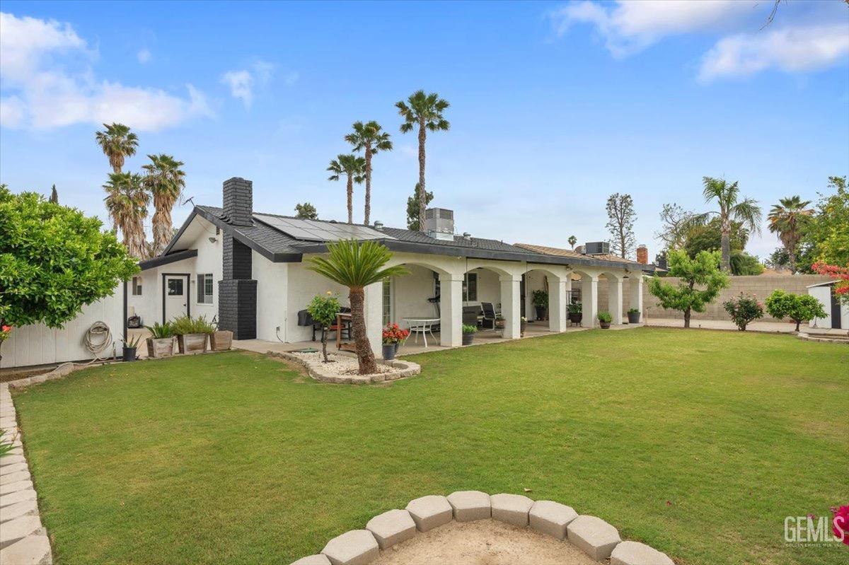 Undisclosed Address Bakersfield, CA 93309 - Photo 22 of 30 a front view of a house with garden