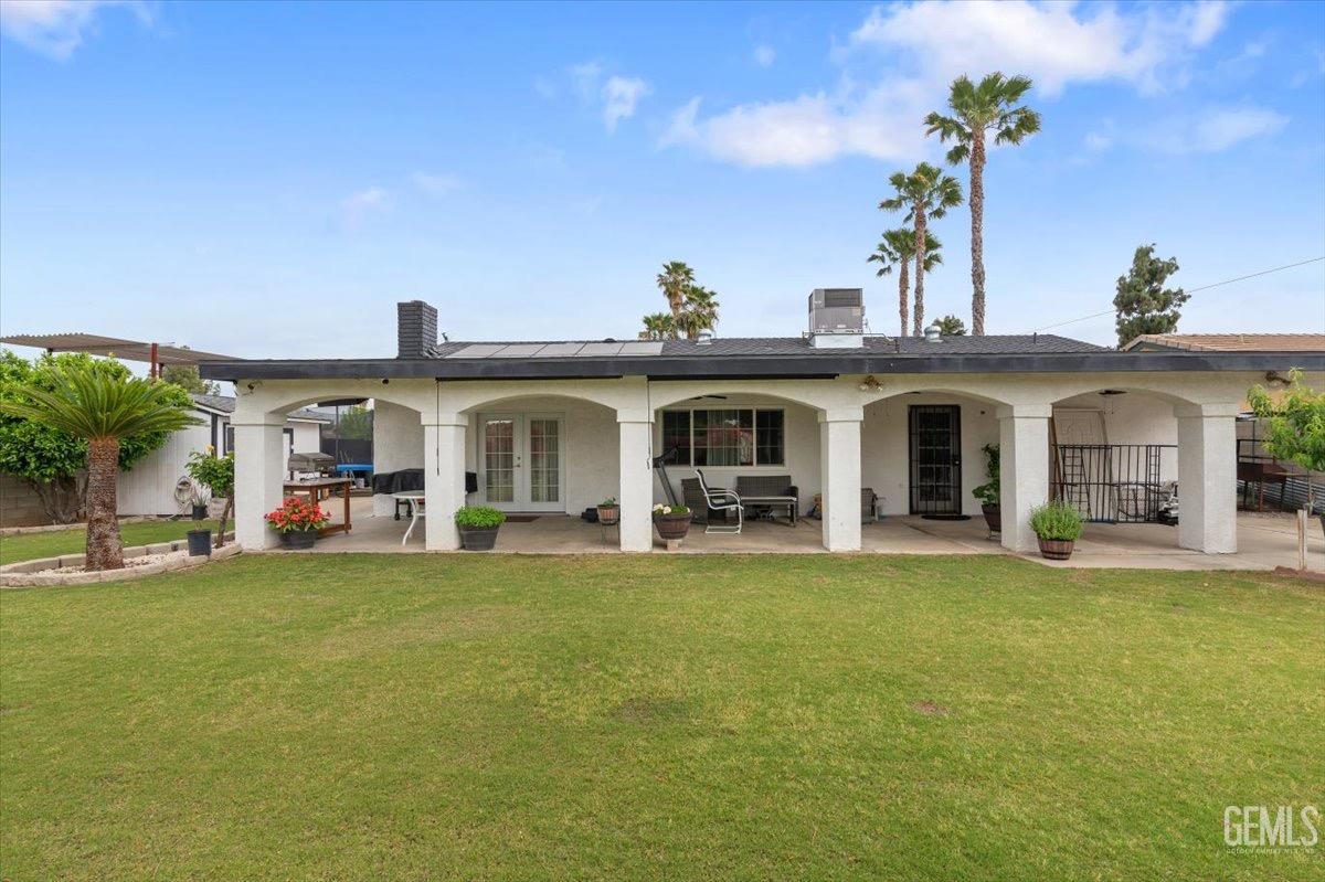 Undisclosed Address Bakersfield, CA 93309 - Photo 23 of 30 a view of a house with swimming pool and a yard