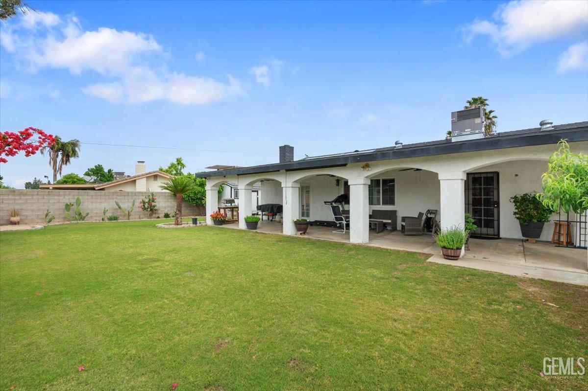 Undisclosed Address Bakersfield, CA 93309 - Photo 24 of 30 a front view of house with outdoor seating and green space