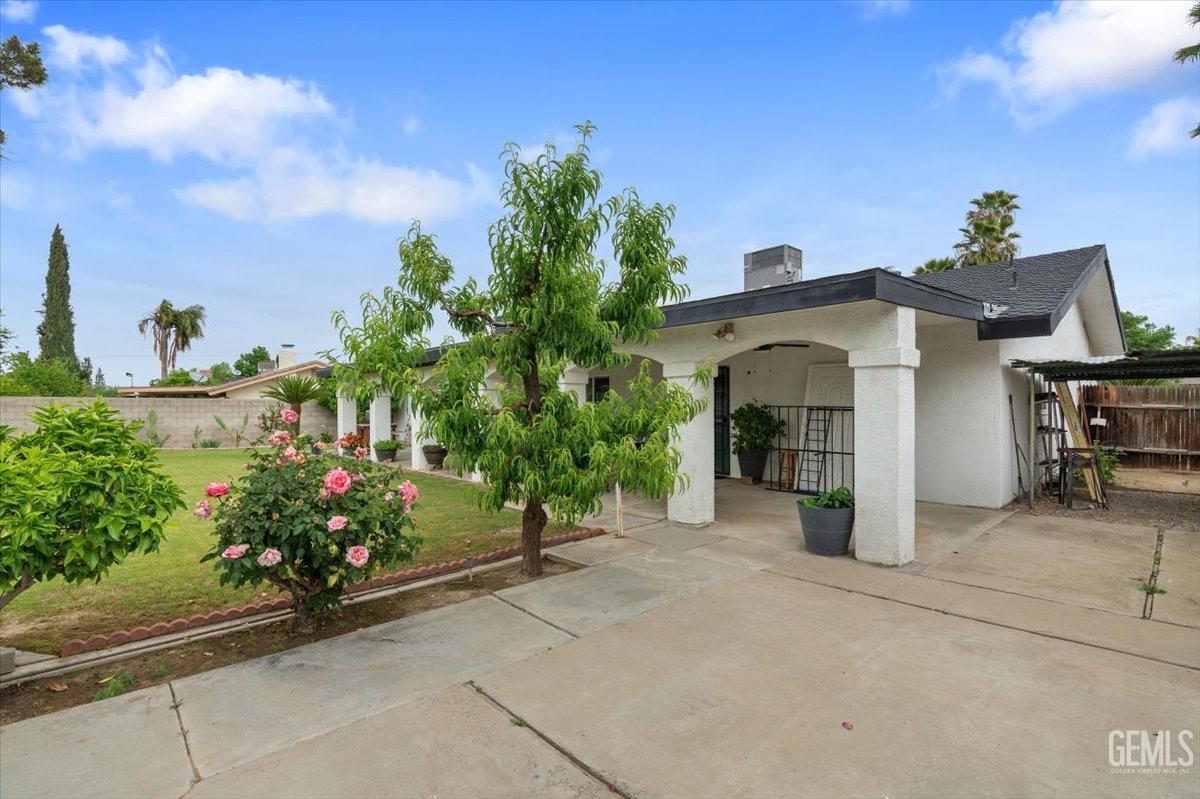 Undisclosed Address Bakersfield, CA 93309 - Photo 25 of 30 a front view of a house with a yard