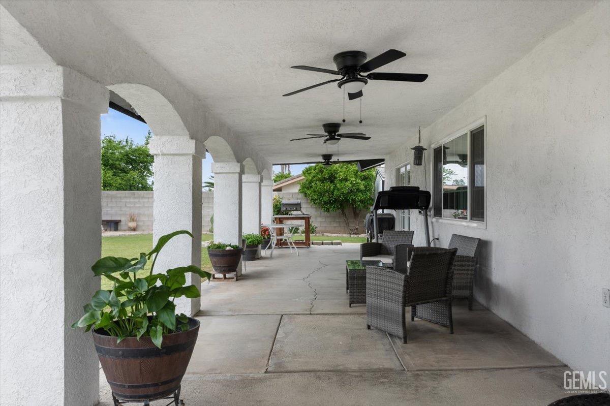 Undisclosed Address Bakersfield, CA 93309 - Photo 27 of 30 a living room with furniture and a potted plant
