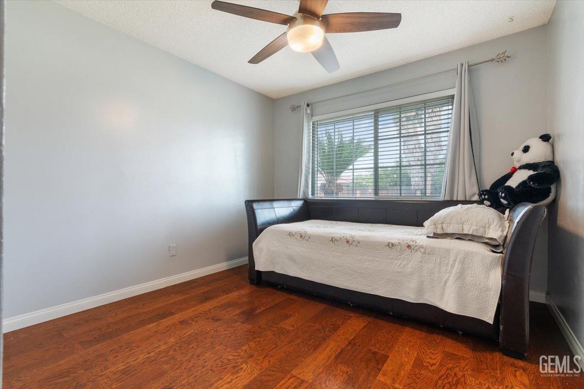 Undisclosed Address Bakersfield, CA 93309 - Photo 4 of 30 a bed sitting in a bedroom next to a window