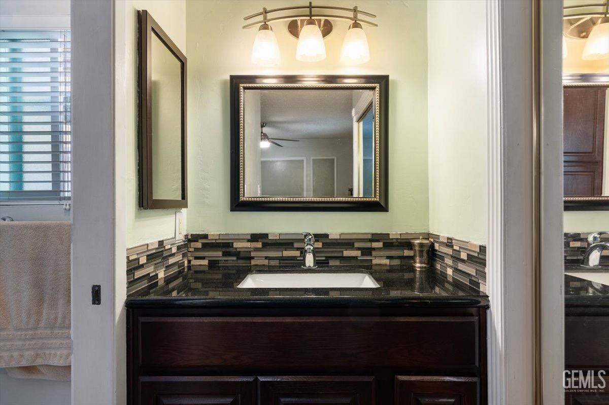 Undisclosed Address Bakersfield, CA 93309 - Photo 9 of 30 a bathroom with a sink and a mirror