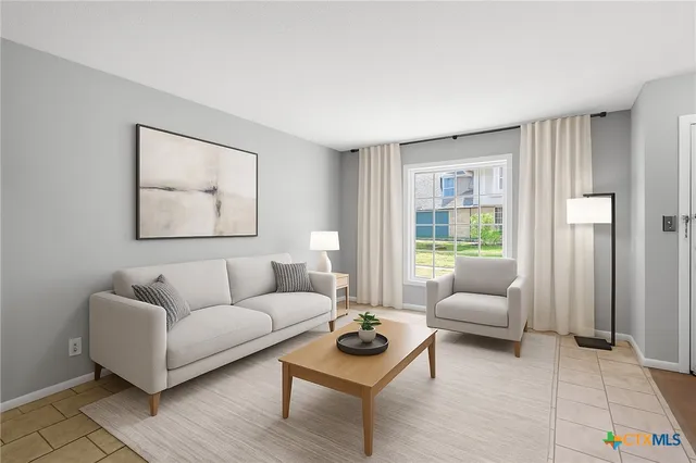 a living room with furniture and a large window