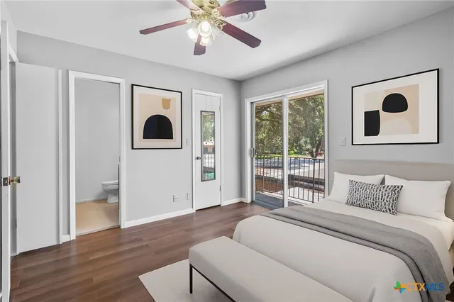 a bedroom with a large bed and a window