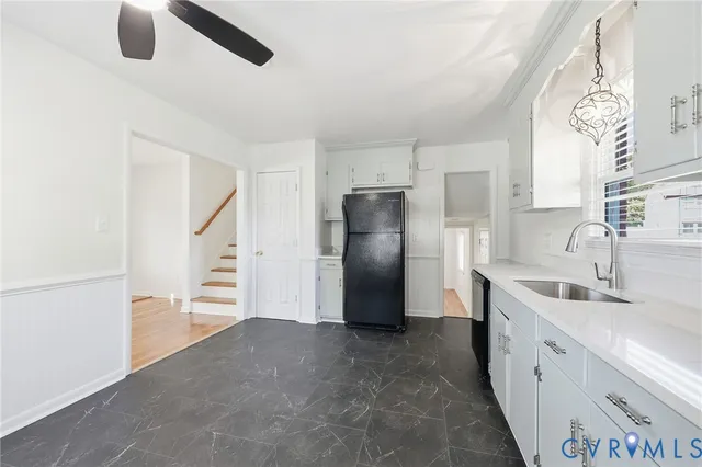 a kitchen with stainless steel appliances a refrigerator and a sink