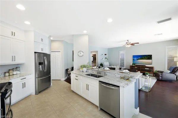 a kitchen with a sink stove and refrigerator