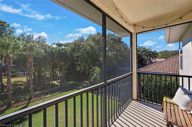 a view of a balcony with wooden floor