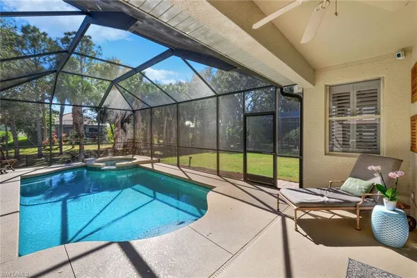 a view of a swimming pool with a lounge chairs