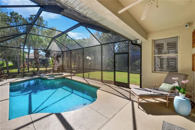 a view of a swimming pool with a lounge chairs