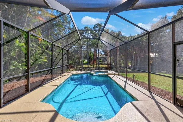 a view of a swimming pool with a patio