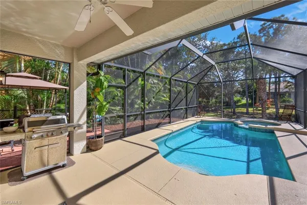 a view of backyard with outdoor seating and plants