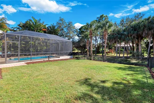 an aerial view of multiple houses with yard