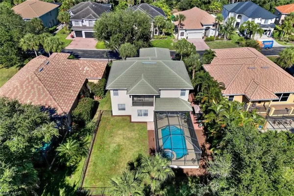 an aerial view of a house with outdoor space and street view