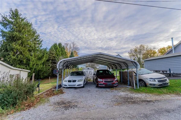a view of a car parked in back of a house
