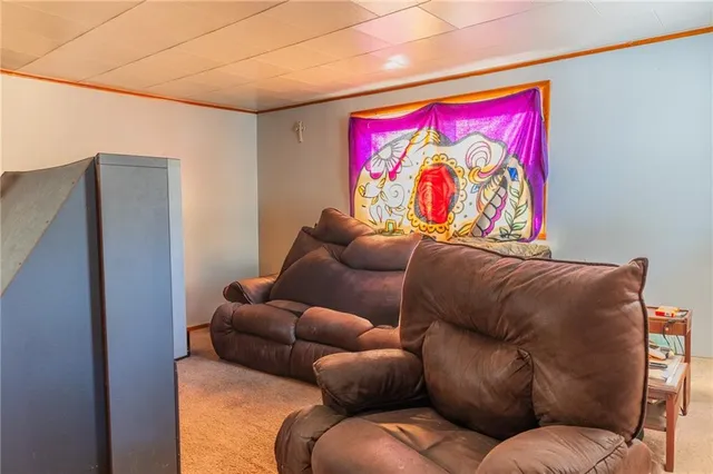 a blue couch sitting next to a white walls