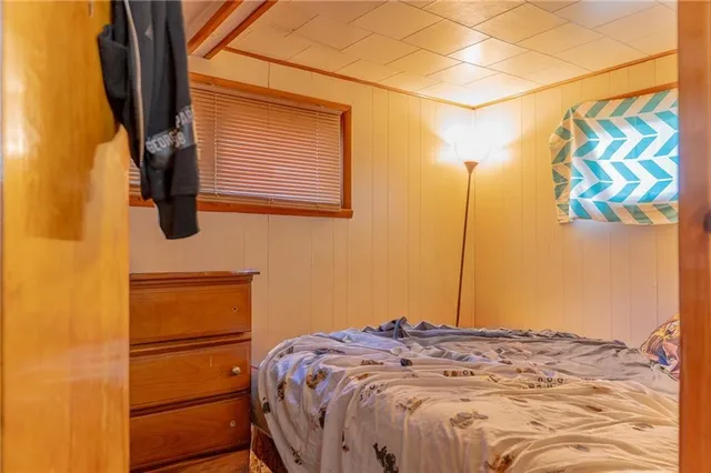 a bedroom with a bed and cabinets