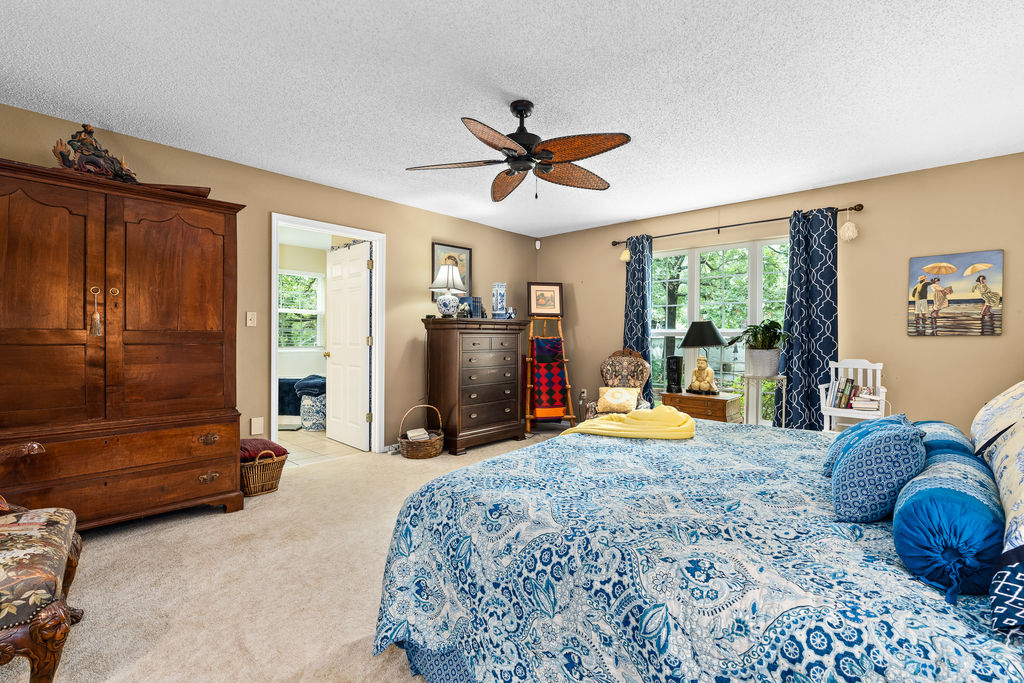365 Calihan Road Booneville, AR 72927 - Photo 39 of 59 Carpeted room with a ceiling fan, a window, and a white door frame