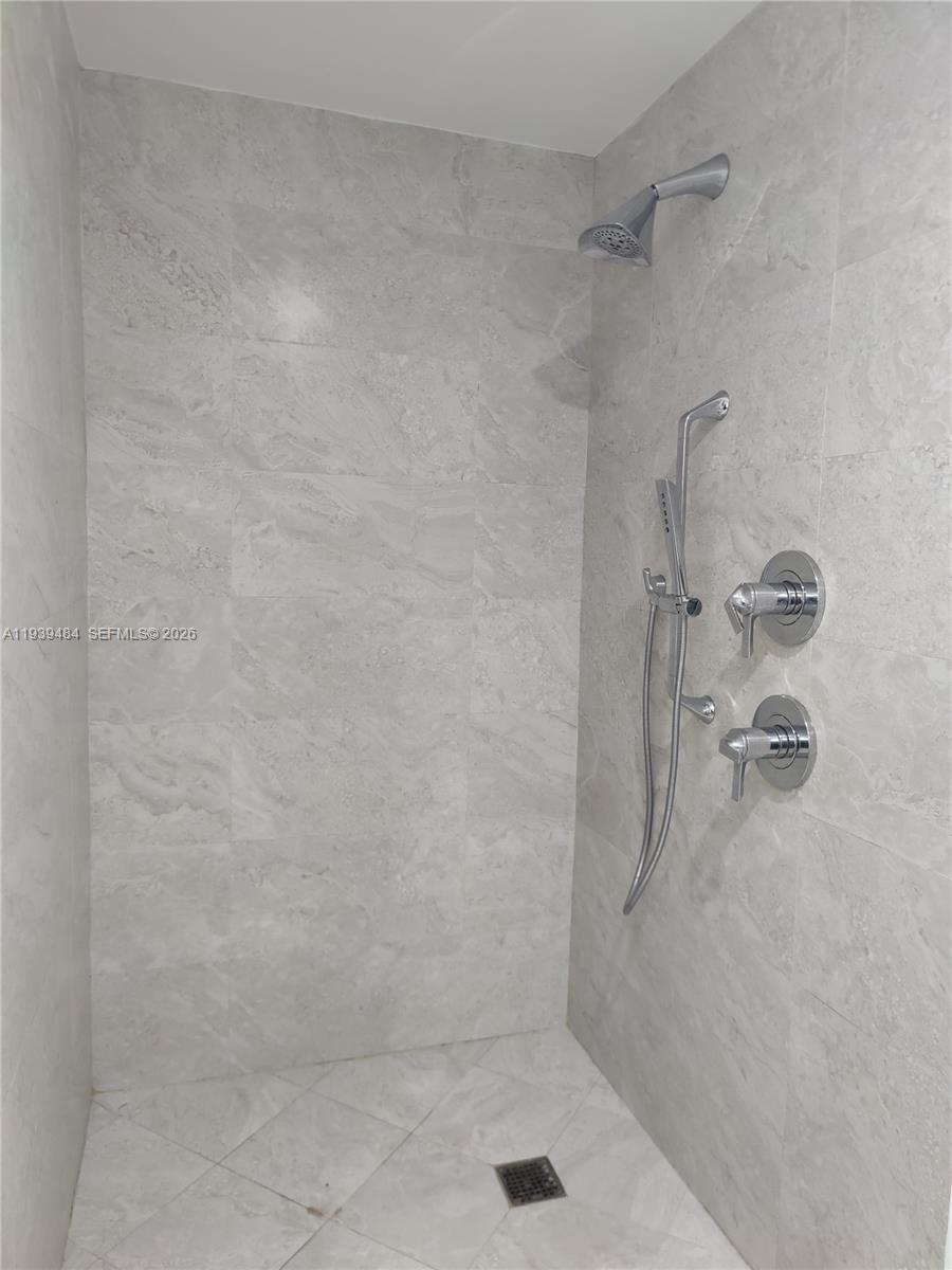 488 Northeast 18th Street, Unit 403 Miami, FL 33132 - Photo 9 of 13 a bathroom with a shower