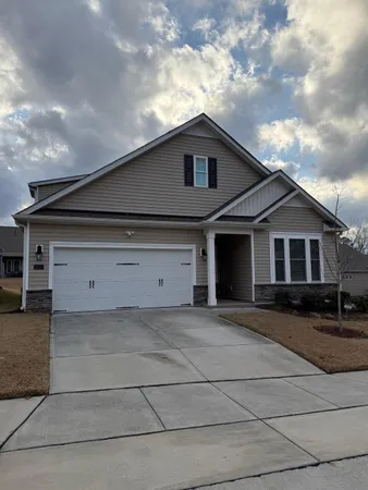 a front view of a house with yard