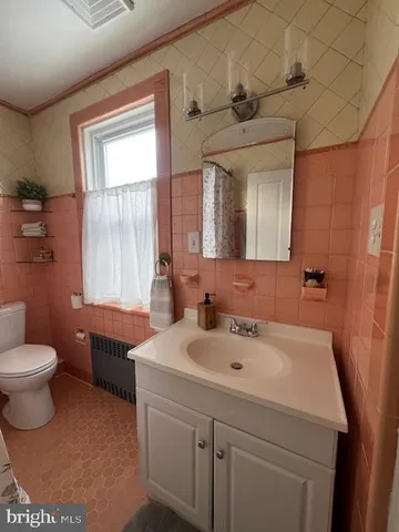 a bathroom with a sink and a toilet