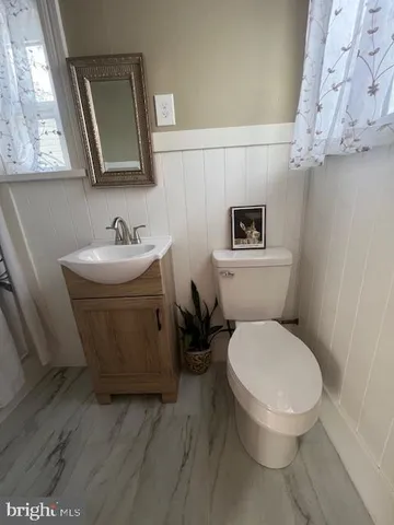 a stove top oven sitting inside of a kitchen
