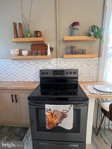 a bathroom with a shower and a sink