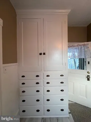 a kitchen with a refrigerator and a sink