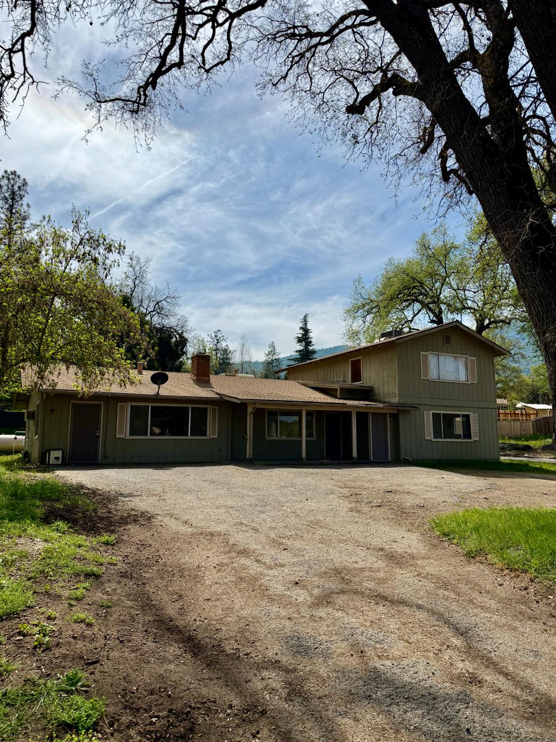 48963 River Park Road, Unit 13 Oakhurst, CA 93644 - Photo 2 of 33 driveway up to Triplex. It is set at the back of the property.