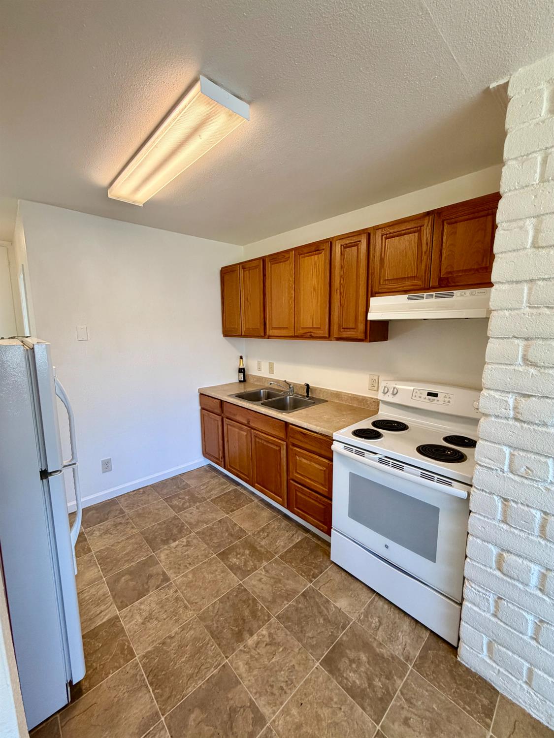 48963 River Park Road, Unit 13 Oakhurst, CA 93644 - Photo 27 of 33 Kitchen in unit #1.