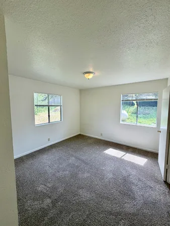 a view of an empty room and window