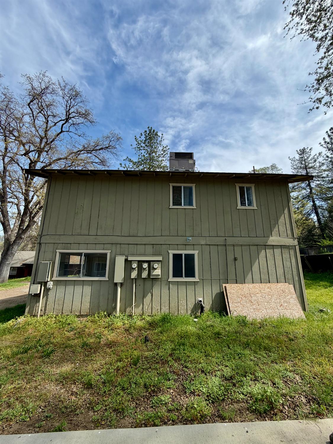 48963 River Park Road, Unit 13 Oakhurst, CA 93644 - Photo 32 of 33 Side of Triplex. Has separate meters for power and propane for each unit.