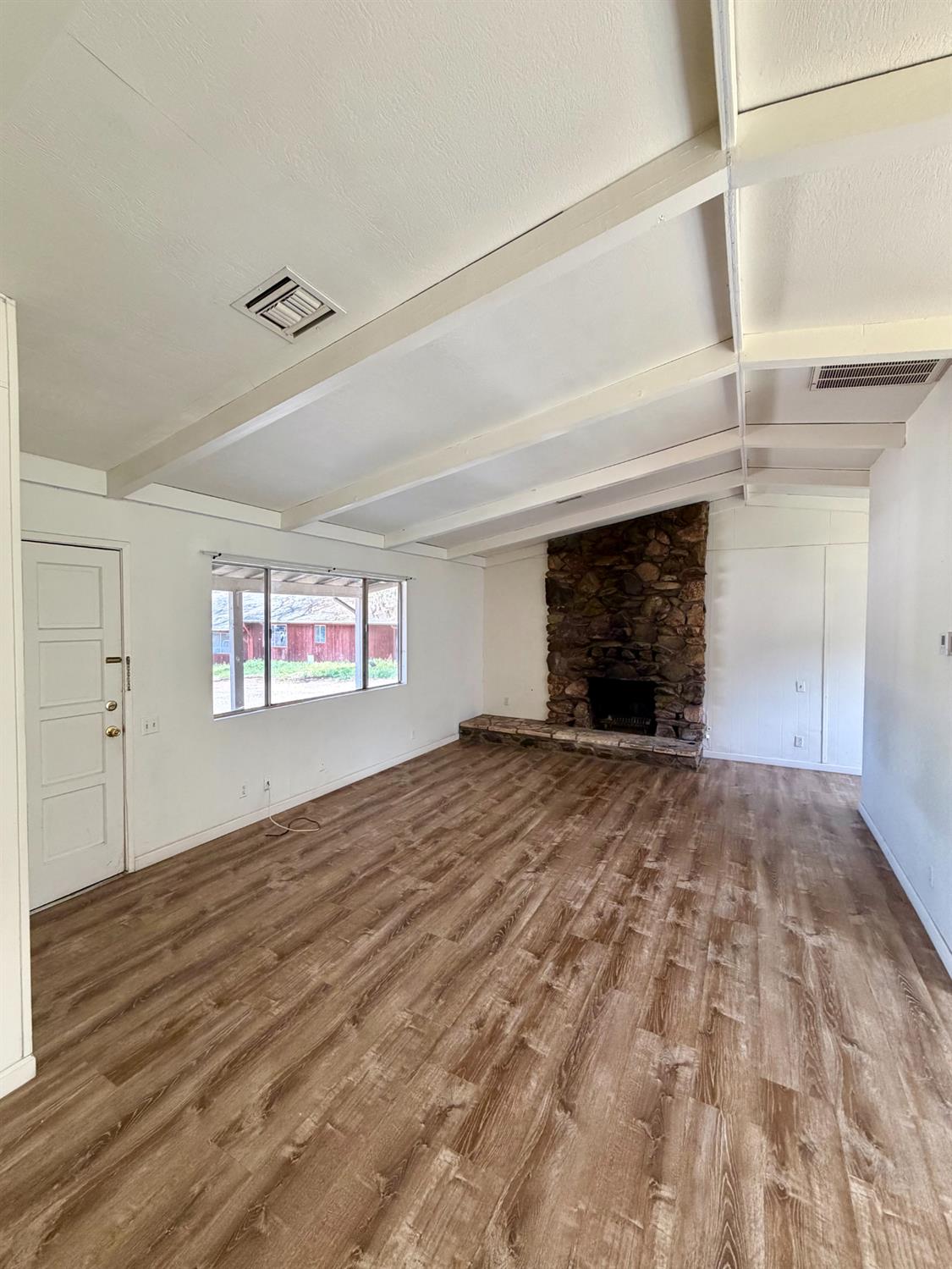 48963 River Park Road, Unit 13 Oakhurst, CA 93644 - Photo 6 of 33 Unit 2 has a freestanding fireplace and central heat and air.